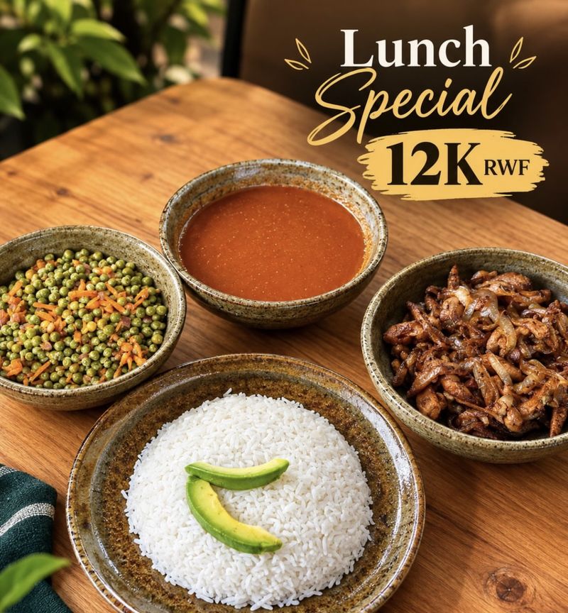 Lunch special: rice topped with avocado, peas with carrots, chicken with onions and a bowl of sauce, for RWF 12,000.