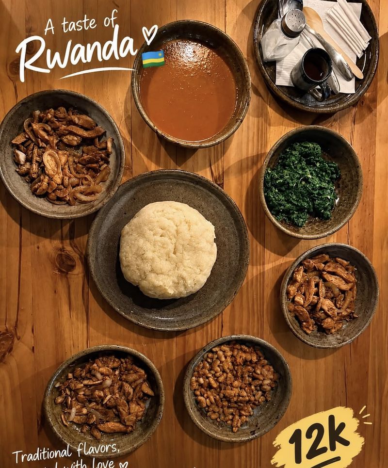 A taste of Rwanda: traditional dishes served in stoneware bowls on a wooden table.